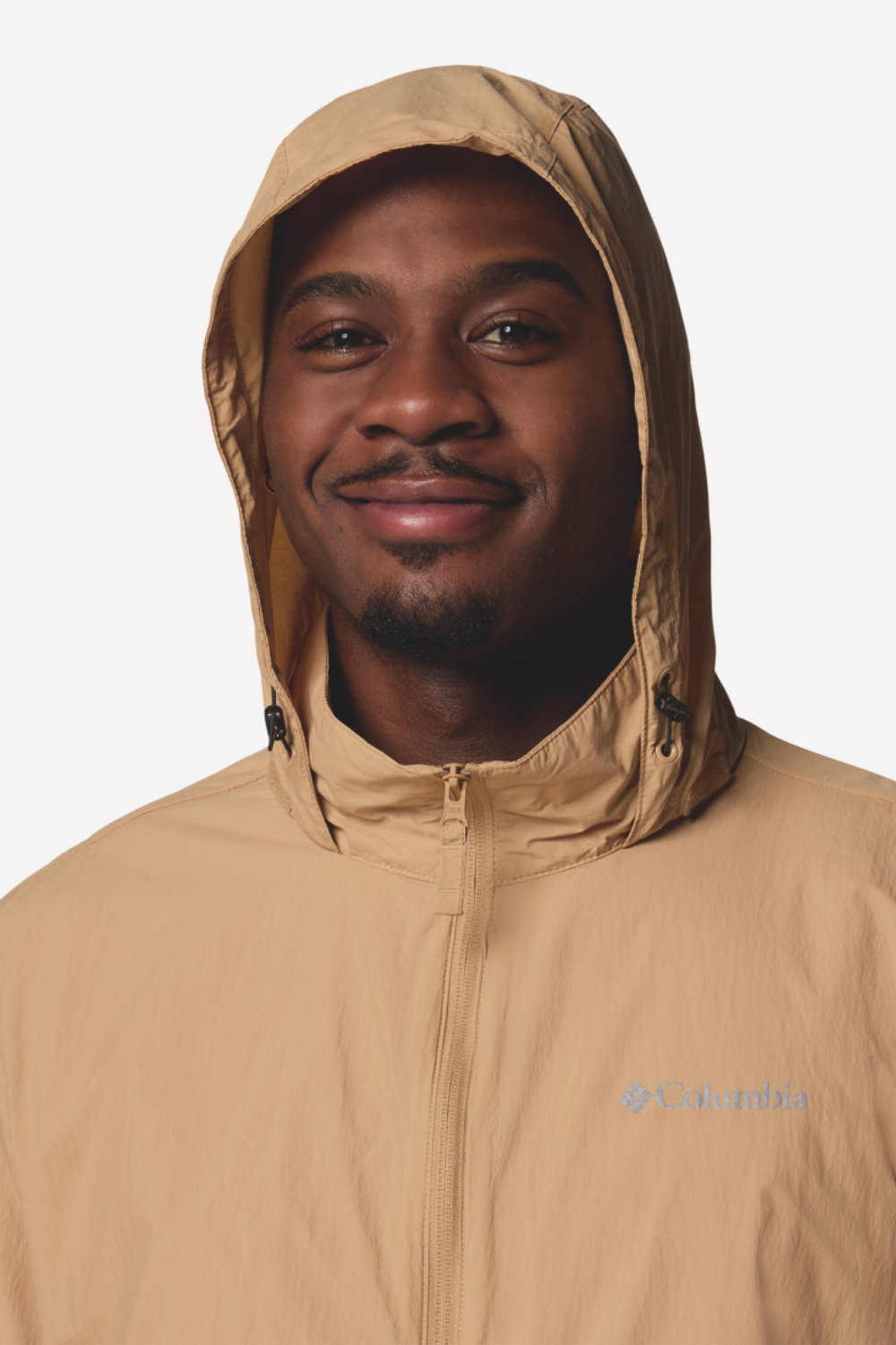 Veste anti-UV beige pour homme, légère et coupe-vent, avec protection solaire UPF 50+ de la marque Columbia.