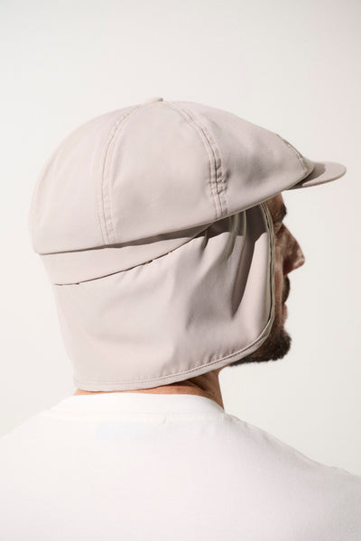 Casquette gavroche anti-UV beige pour homme, protection solaire UPF50+, idéale pour les activités en extérieur.