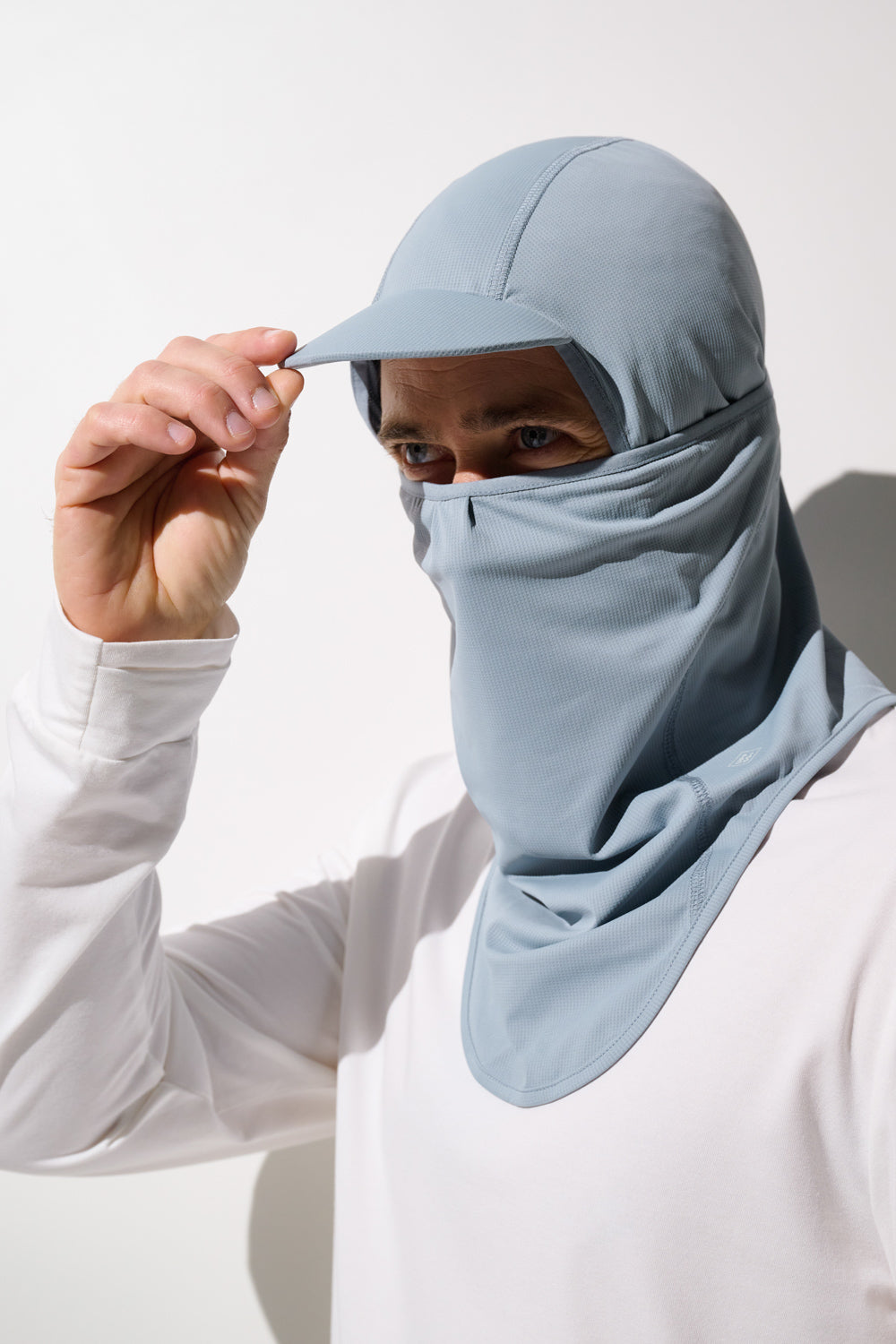 Cagoule visière anti-UV - Ventoux, légère et respirante, couleur bleu pour homme, offrant une protection solaire UPF 50+.