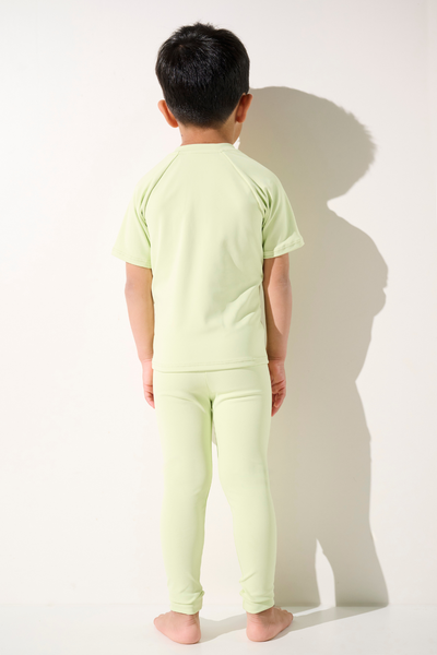 T-shirt de bain anti-UV - Samoa vert clair pour enfant, tissu léger UPF 50+ idéal pour la plage.