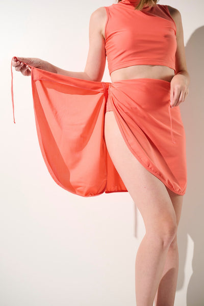 Jupe de bain anti-UV - Capri en corail pour femme, élégante et légère avec protection solaire UPF 50+.