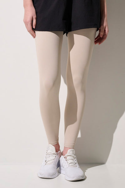 Jambières anti-UV Ventoux beige pour femme, UPF 50+, idéales pour le cyclisme ou la course à pied.
