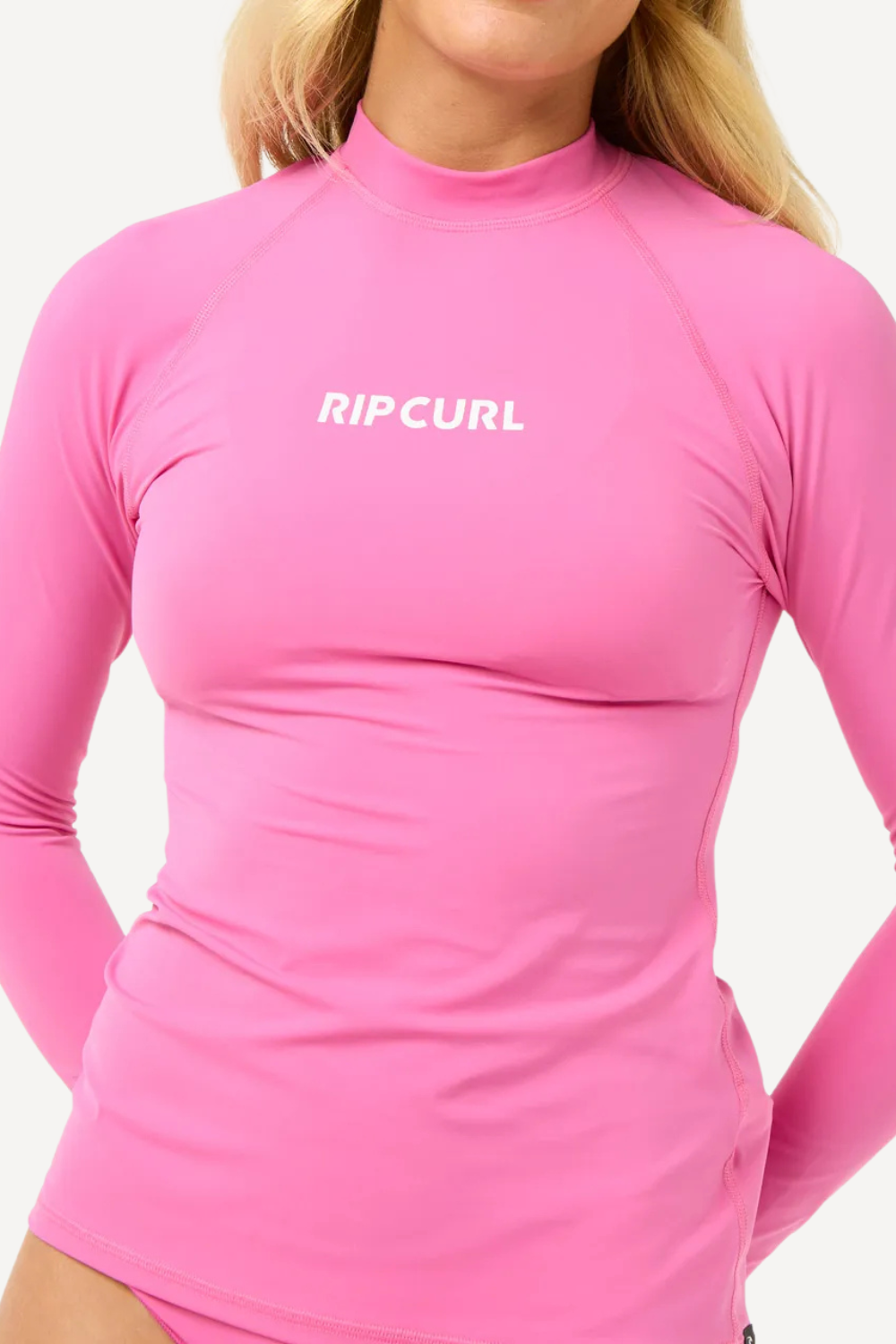 T-shirt de bain anti-UV rose pour femme, manches longues, UPF 50+ de Rip Curl, parfait pour la plage.