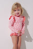 Maillot de bain anti-UV manches longues - Flores pour enfant, rose à motifs, UPF 50+, idéal pour jouer au soleil.